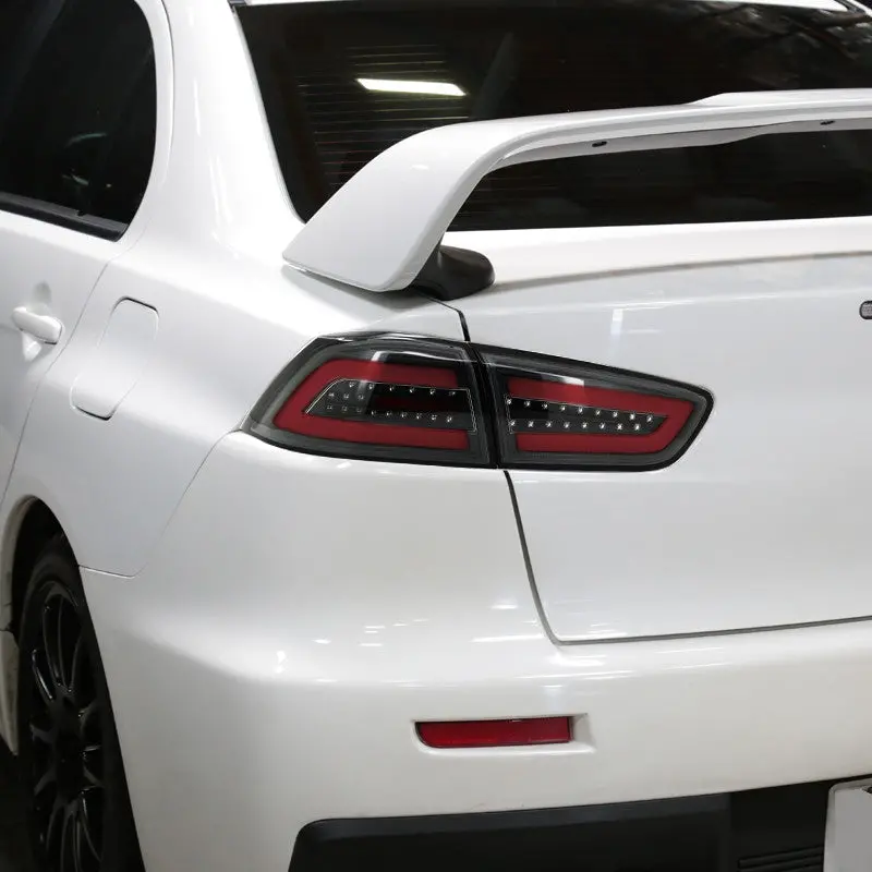 Spec-D 08-17 Lancer Evo X Led Tail Lights Black/Clear Lens Red Bar 2